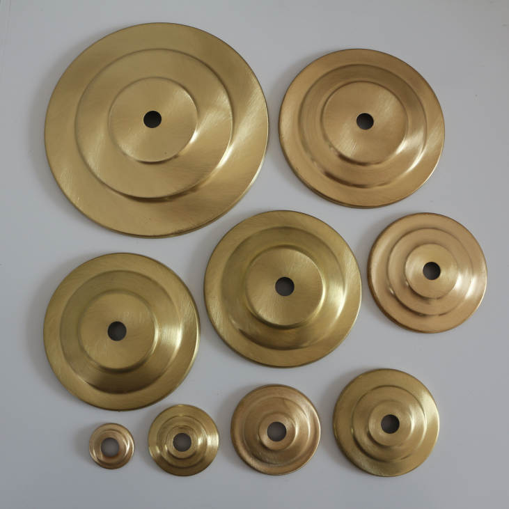 Brushed brass top for pots or vases that can be transformed into lamps.
