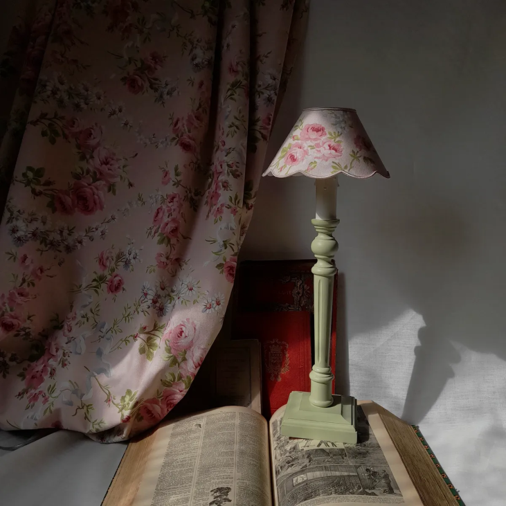 Small romantic candlestick lamp created by CÔTE OUEST DÉCO, topped with its small floral lampshade.