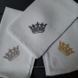 White linen tea towel embroidered with a crown. Available in 3 colours. Made in France
