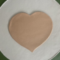 The back of the gold heart leatherette placemat is made of solid red leatherette.