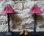 Table lamp ÉLISABETH in black wood and its shade in crimson red pleated silk.