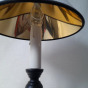 Gilded interior of the black twisted lamp's clip-on shade.